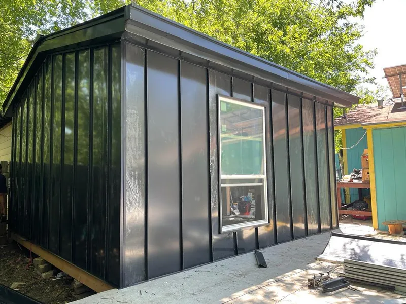 Black standing seam metal wall panels for Roof Inspection in Bemidji