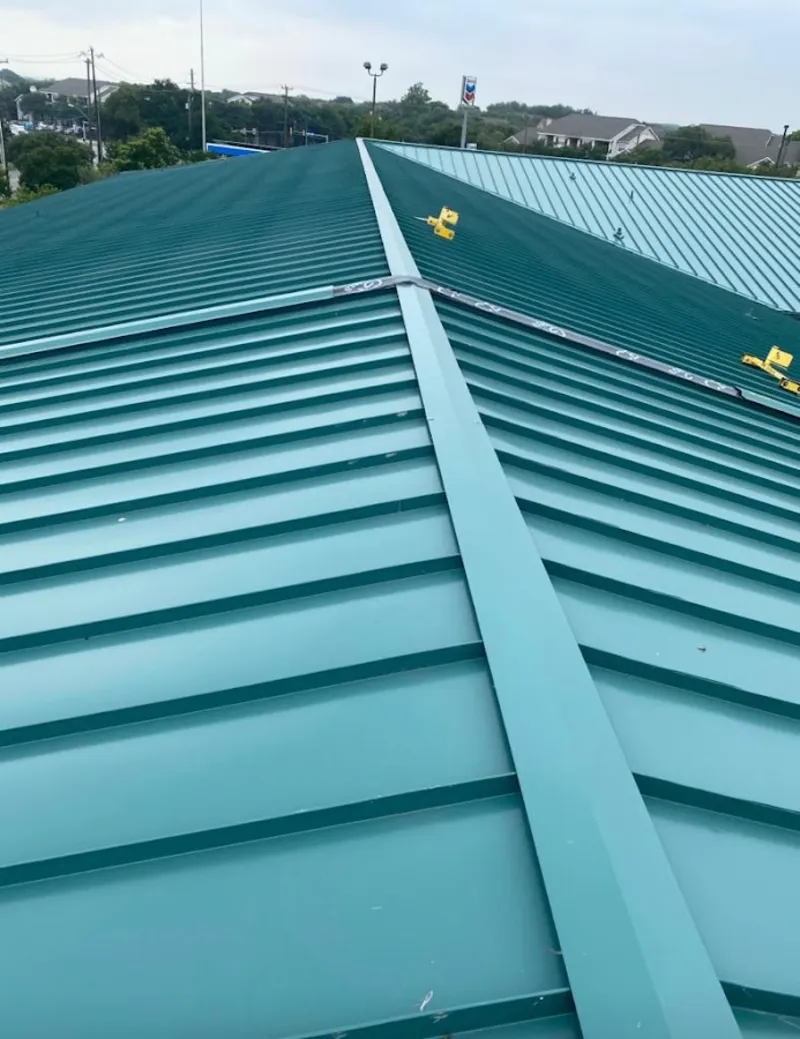 Green commercial metal roof ridge and valley for Metal Roof Repair in Bemidji